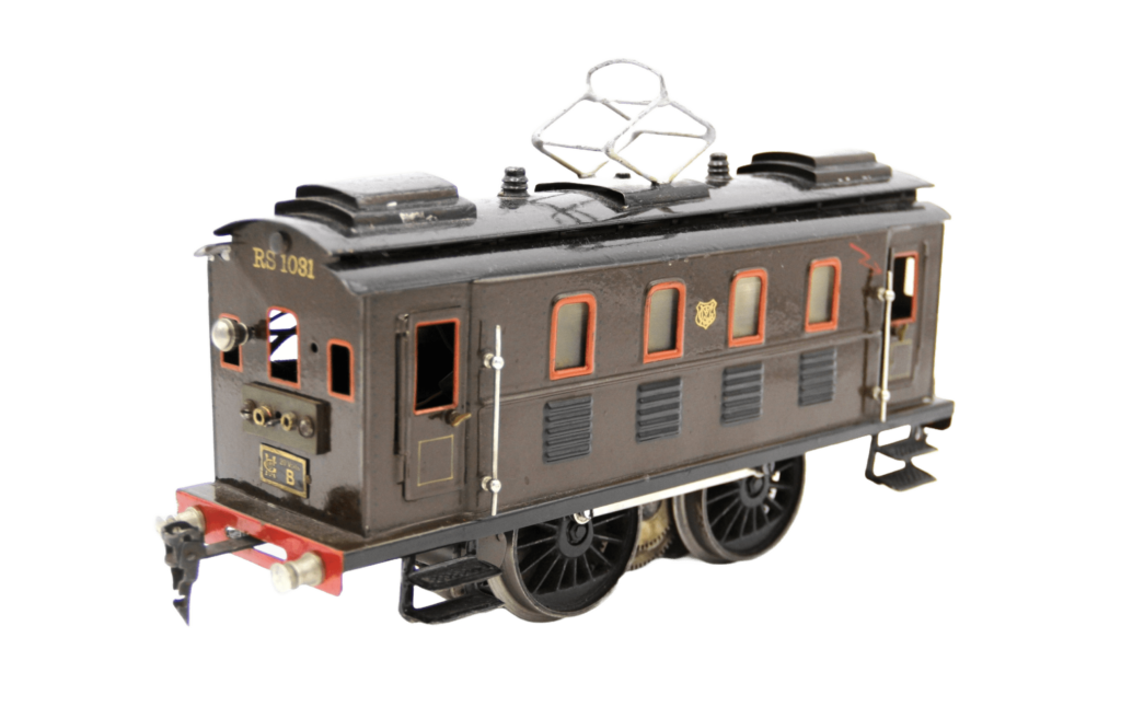 Dunkelbrauner Wagon mit mehreren rot umrandeten Fensterchen und der Aufschrift RS 1031.